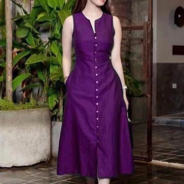 Slim fit waist cinching solid color sleeveless mid length dress