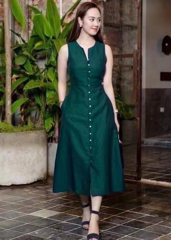 Slim fit waist cinching solid color sleeveless mid length dress